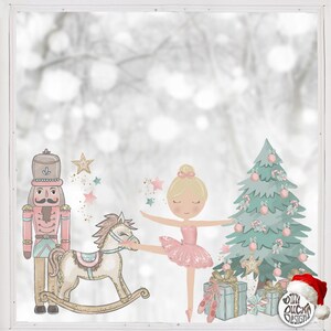 May include: A Christmas window cling set featuring a ballerina, a nutcracker, a rocking horse, a Christmas tree, and presents. The set is decorated with glitter and stars.