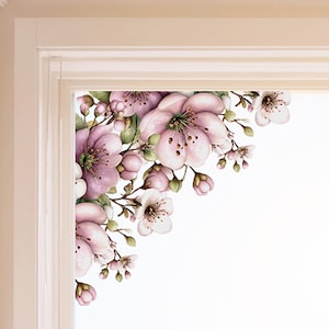 May include: A corner window decal featuring watercolor-style cherry blossoms in shades of pink and white. The floral design includes detailed petals, buds, and green leaves, creating a delicate and artistic aesthetic. The decal is designed to be placed in the corner of a window.