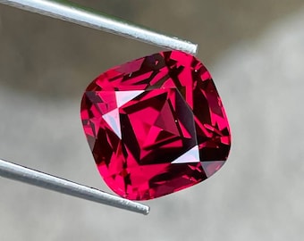 Tanzanian Pink Red Garnet: 8.46 Carat Cushion Cut Gemstone