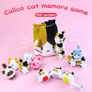 May include: A collection of handmade crochet calico cat toys and a matching drawstring bag, all in a variety of colors including white, black, yellow, pink, and blue. The bag and toys are arranged on a pink background. The text "Calico cat memory game" and "PDF pattern" are visible.