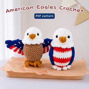 May include: Two crocheted American eagle plushies with white heads and yellow beaks. One eagle has brown wings with red and white stripes, while the other has a red and white striped body with blue wings. Text reads: American Eagles Crochet PDF pattern.