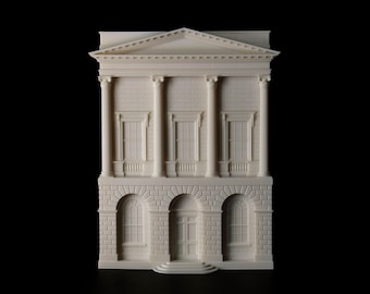 May include: A detailed, off-white miniature building with classical architectural elements. The model features columns, windows, and a pediment, set against a black background. The building has a two-story design with arched openings on the lower level.
