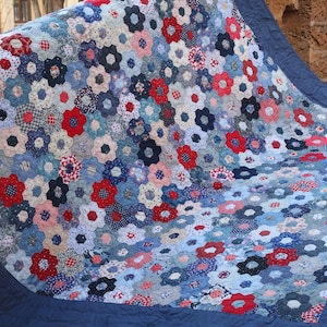 blue and red quilt , handmade , hand block printed quilt , colourful patchwork , A blue hand quilted hexagon blanket