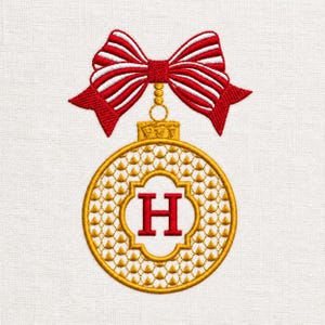 May include: An embroidered design featuring a round gold ornament with a textured scale pattern and a red letter H in the center. The ornament is topped with a gold cap and a large red and white striped bow with red stitched edges.