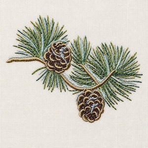 May include: An embroidery design featuring a pine branch with two brown pinecones and green and light blue pine needles. The branch is rendered in a light brown thread, and the entire motif is stitched onto a textured off-white fabric background.