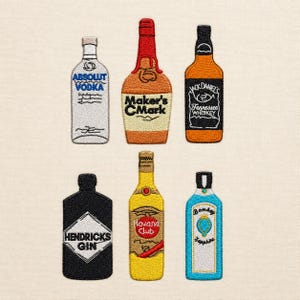 May include: Six embroidered patches shaped like liquor bottles. The top row features Absolut Vodka, Maker's Mark, and Jack Daniel's. The bottom row features Hendrick's Gin, Havana Club, and Bombay Sapphire. Each patch displays the brand name and logo.