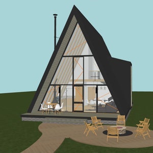 May include: A-frame house architectural rendering. The house has a black roof and large glass windows. A patio with chairs and a fire pit is in front of the house. The house is set on a green lawn with a light blue sky in the background.