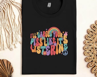 May include: Black t-shirt with a colorful retro graphic that says "I'll gargle your piss like it's listerine" with peace signs and flowers.