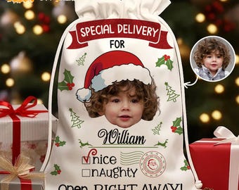 May include: A white Christmas gift bag with a drawstring closure. The bag features a child's photo wearing a Santa hat, the name "William", and the text "Special Delivery For" and "Open RIGHT AWAY!" with a "Nice" check box.