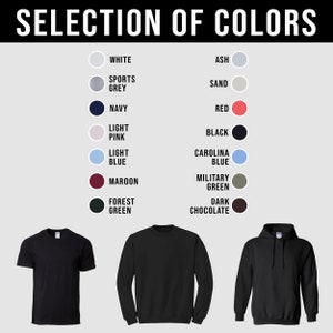K&ouml;nnte beinhalten: Eine Auswahl an Farben f&uuml;r T-Shirts, Sweatshirts und Hoodies. Die Farben umfassen Wei&szlig;, Asche, Sportgrau, Marineblau, Hellrosa, Hellblau, Rotbraun, Waldgr&uuml;n, Sand, Rot, Schwarz, Carolina Blau, Milit&auml;rgr&uuml;n und Dunkelbraun.