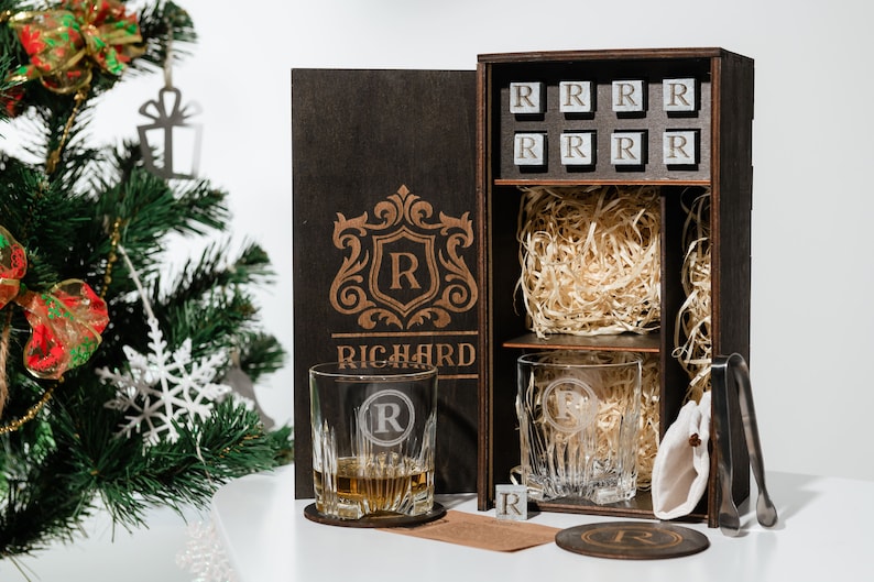 Elevate your home bar with this exquisite decanter set, featuring personalized whiskey glasses and sophisticated wooden coasters, handcrafted to perfection for whiskey aficionados.