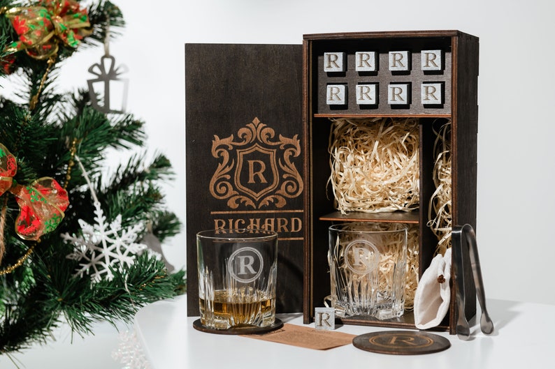 Elevate your home bar with this exquisite decanter set, featuring personalized whiskey glasses and sophisticated wooden coasters, handcrafted to perfection for whiskey aficionados.