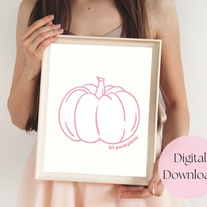 May include: A printable digital download featuring a pink outline of a pumpkin with the text "hi pumpkin" underneath.