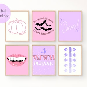 May include: Set of six printable Halloween themed wall art prints in pink and purple. The prints feature a pumpkin, bats, the words "It's Frickin' Bats I Love Halloween", "Boo", a vampire mouth, a witch with a broom, and candy corn.
