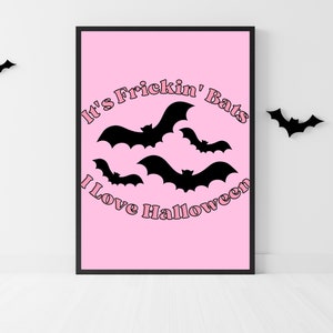 May include: Pink printable poster with the text "It's Frickin' Bats I Love Halloween" in a pink retro font. The poster features black silhouettes of bats flying in a circle.