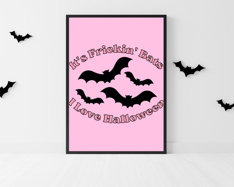 May include: Pink printable poster with the text "It's Frickin' Bats I Love Halloween" in a pink retro font. The poster features black silhouettes of bats flying in a circle.