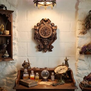 Gothic carved wood clock hanging on a wall in a dark academia style study
