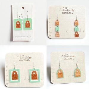 Peut inclure: Une collection de boucles d'oreilles avec un motif de cadenas. Les boucles d'oreilles sont de différents styles, notamment des formes carrées et rectangulaires, et un design superposé. Les cadenas sont de couleur cuivre pailleté et les cadres sont vert menthe. Le texte "THE THANKFUL CREATIONS" est visible.