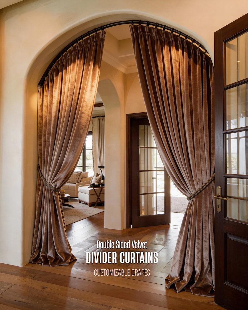 Double-sided luxe velvet divider curtains in warm taupe-brown tones, hung on black curved metal rod. Elegant room divider drapes with rope tiebacks and tassels, featuring sophisticated pleats and full floor-length drape. Customizable luxury curtain panels ideal for archway entrances, bedroom partition, or creating separate room spaces. High-end interior design window treatment with rich velvet texture. Professional home decor solution for modern and classical interiors.