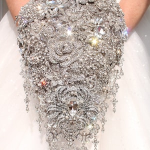 Wedding bouquet made of silver colored brooches and jewelry in teardrop shape with cascading details