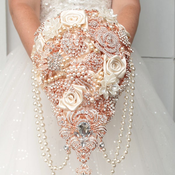 Cascade brooch bouquet. Rose gold wedding bouquet. Ivory bridal bouquet. White jeweled bouquet.