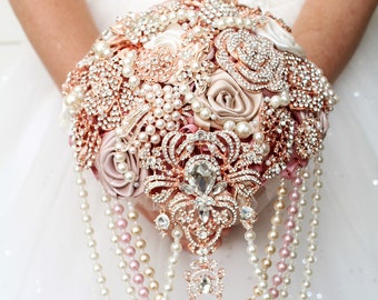 Rose gold brooch bouquet. Dusty rose wedding bouquet. Cascade champagne jeweled bouquet.