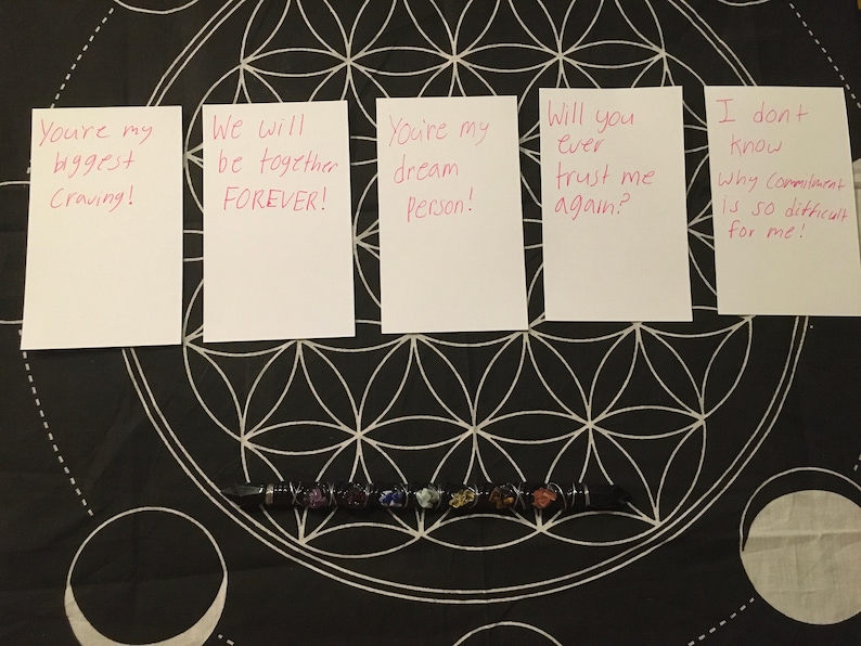 May include: Five white cards with pink handwritten messages on a black background. The messages are: "You're my biggest Craving!" "We will be together FOREVER!" "You're my dream Person!" "Will you ever trust me again?" "I don't know why Commitment is so difficult for me!"