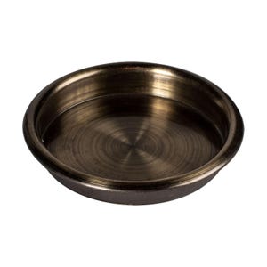 May include: A round, brushed metal cup with a slightly raised rim. The cup is a dark bronze color and has a circular pattern on the bottom.