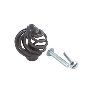 May include: A dark gray metal cabinet knob with a spiral design. The knob comes with two screws for installation.