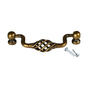 May include: Antique brass cabinet pull with a twisted wire design and two round knobs. The pull comes with two screws.