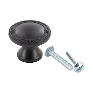 May include: Black cabinet knob with a decorative design and two screws.