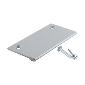 May include: A silver cabinet pull with a rectangular shape and rounded edges. The pull comes with two screws for installation.