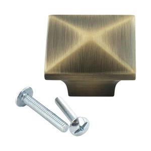 May include: Square cabinet knob with a brushed antique brass finish. The knob has a slightly raised center and comes with two screws.