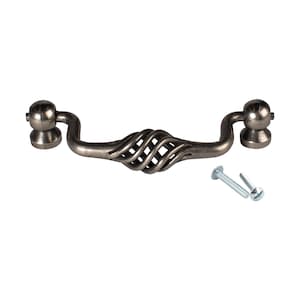 May include: A silver-toned cabinet pull with a twisted wire design and rounded ends. The pull comes with two screws.