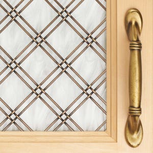 May include: A close-up of a wooden door with a decorative bronze-colored handle and a window with a diamond-patterned metal grid. The window's glass has a textured, white appearance, and the door frame is light-colored wood.