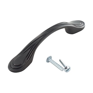 May include: A black metal cabinet pull with a curved design and a textured surface. The pull comes with two silver screws.