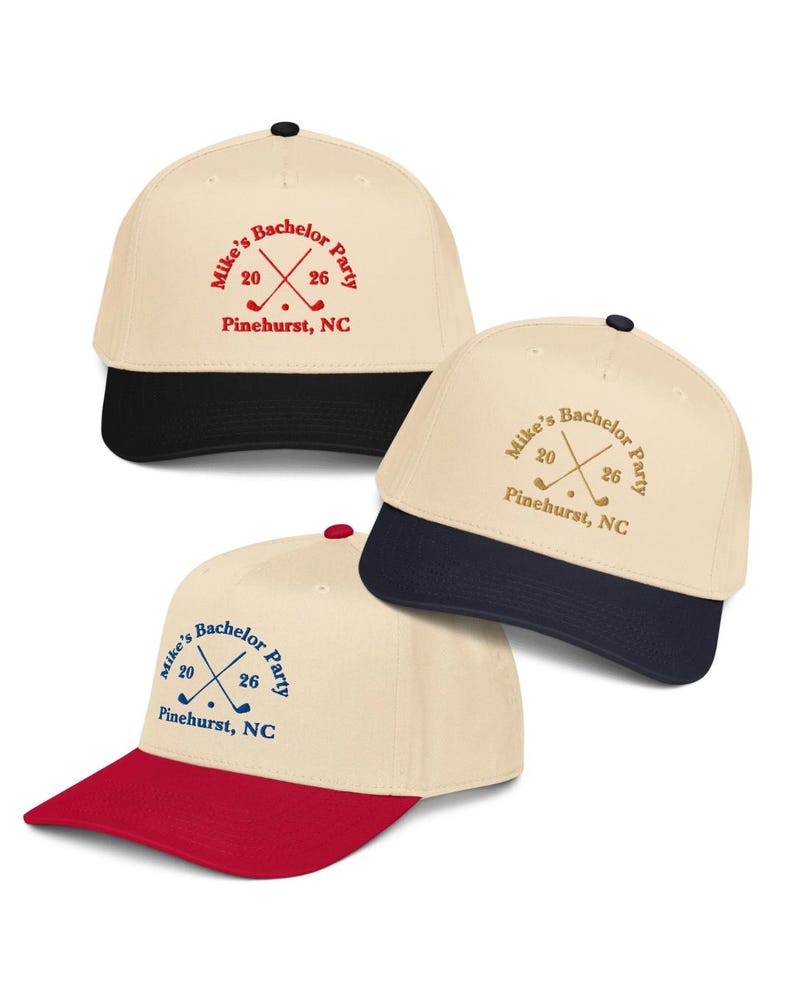 May include: Three baseball caps with a cream-colored crown and a colored brim. Each cap has the text "Mike's Bachelor Party 2026 Pinehurst, NC" with crossed golf clubs. The brims are black, navy, and red.