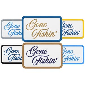 May include: Rectangular embroidered patches with the text "Gone Fishin'" in various colors. The patches have white backgrounds with borders in blue, gold, black, brown, yellow, and gray. The text is in a cursive font.