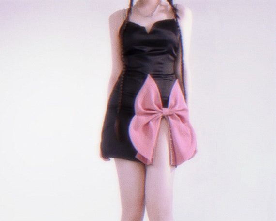 Black dress top with pink bow