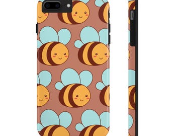 May include: A brown phone case with a pattern of cute cartoon bees with yellow and brown stripes and blue wings. The bees have smiling faces.