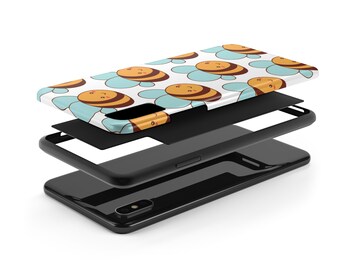 May include: A phone case with a white background and a pattern of cute cartoon bees with blue wings. The case is shown in layers, revealing the black phone case underneath.