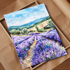 May include: A watercolor painting of a lavender field with a winding path leading to a distant hillside. The sky is blue with white clouds and the field is filled with purple lavender flowers.