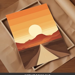 Könnte beinhalten: Ein gerahmter Kunstdruck mit einer minimalistischen Landschaftsszene. Das Kunstwerk zeigt eine Straße, die auf einen Sonnenuntergang mit warmen Orange- und Gelbtönen zuführt. Der Druck befindet sich vor einem braunen Papierhintergrund. Der Text "INSTANT DOWNLOAD" steht unten.