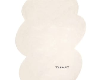 May include: A white fluffy cloud-shaped rug with the text "URBAN" in black.