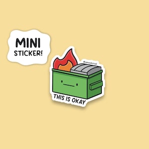 May include: A green dumpster with a smiling face and a fire on top. The dumpster has the text "This is okay" and "@iamdsfried" on it. The text "MINI STICKER!" is in a white speech bubble.