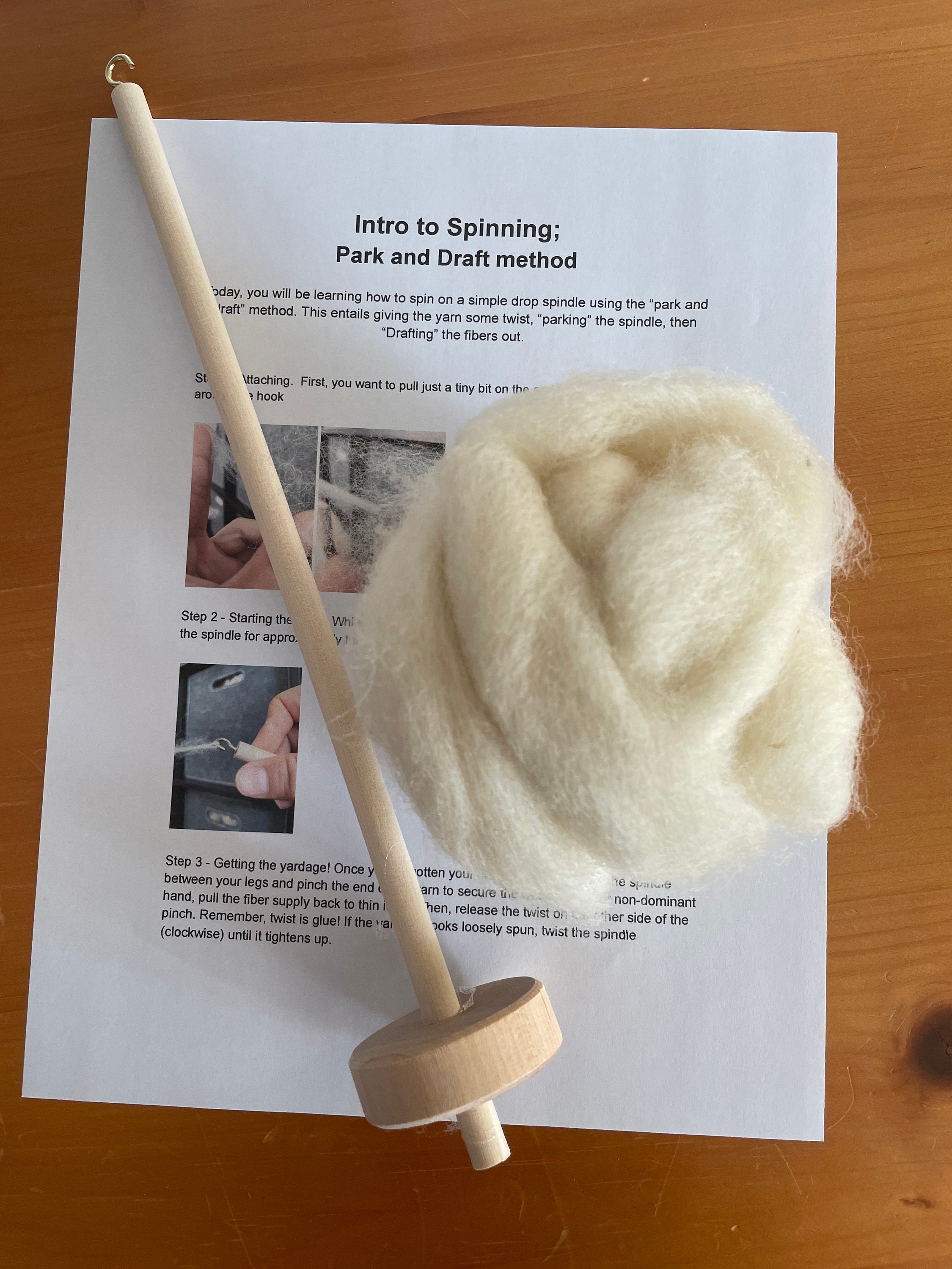 Hand spinning yarn on a drop spindle 