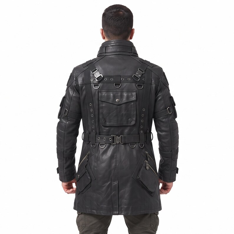 May include: A black leather jacket featuring a high collar, multiple utility pockets, and a waist belt with a buckle. The back design includes integrated straps, metal D-rings, and eyelet details, creating a structured, tactical appearance.