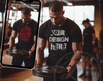 May include: A black t-shirt with the text "YOUR DESIGN HERE" printed in white on the front. The shirt is being held by a person in a gym setting.