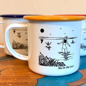Closing down! Sea swimming engraved enamel mug: Can be personalised, blue, red or yellow rim, made in Cornwall.