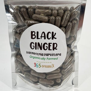 May include: A silver resealable bag filled with brown capsules labeled "BLACK GINGER kaempferia parviflora Organically Farmed 365 organi X"